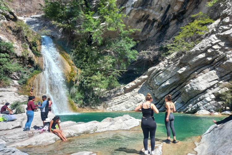 tourist swimming in natural pool